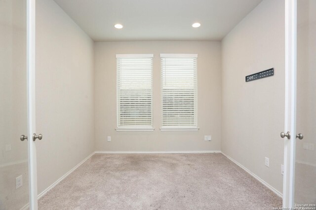 2615 Barkey Spgs, San Antonio, TX 78245 - empty room featuring french doors, baseboards, carpet floors, and recessed lighting