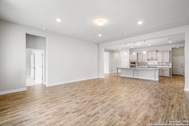 unfurnished living room featuring light hardwood / wood-style flooring