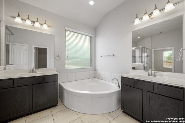 bathroom featuring vanity, lofted ceiling, and plus walk in shower