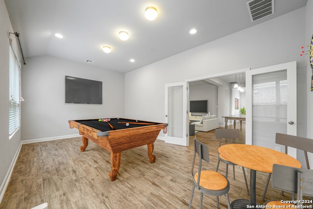 game room featuring lofted ceiling, light hardwood / wood-style flooring, and billiards