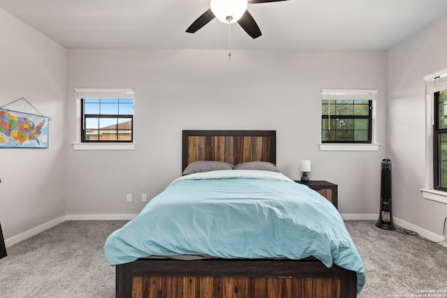 bedroom featuring ceiling fan and light colored carpet