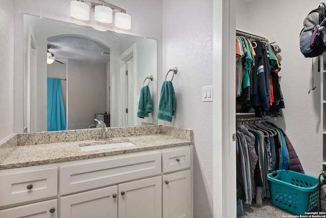 bathroom with vanity and ceiling fan