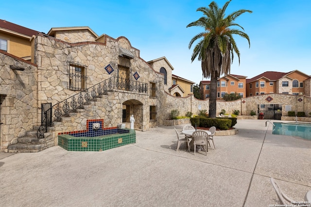 exterior space featuring a community pool