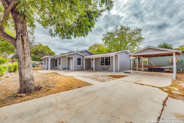 single story home with a carport