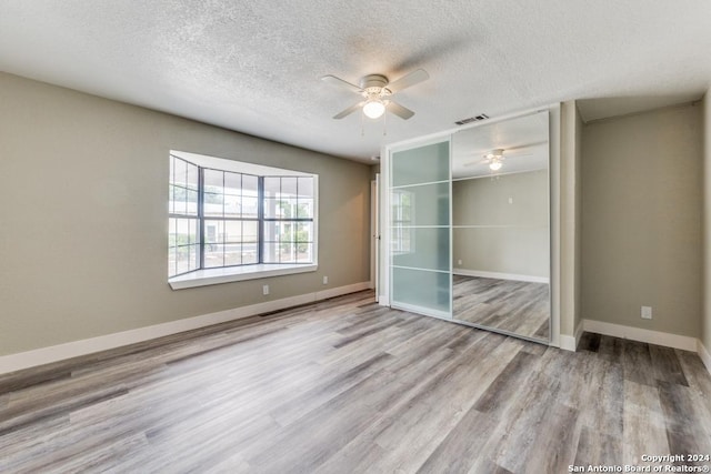 1703 Allende, San Antonio, TX 78237 - unfurnished bedroom with baseboards, wood finished floors, and a closet