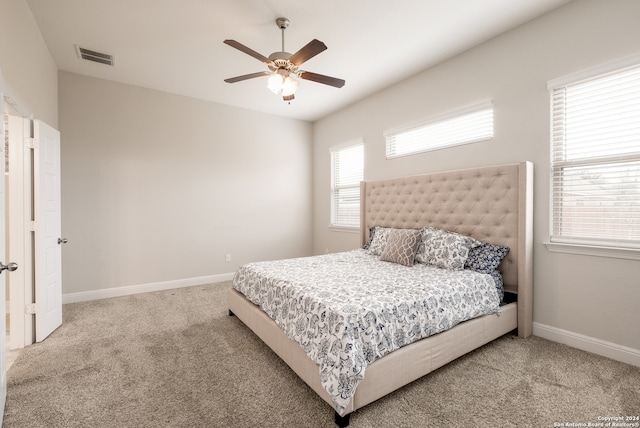 bedroom with ceiling fan and carpet