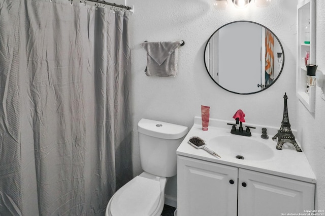 218 Rambling Dr, San Antonio, TX 78220 - full bath featuring vanity, toilet, and a shower with shower curtain