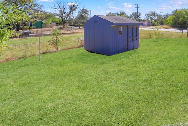 218 Rambling Dr, San Antonio, TX 78220 - view of yard featuring fence, a shed, and an outbuilding