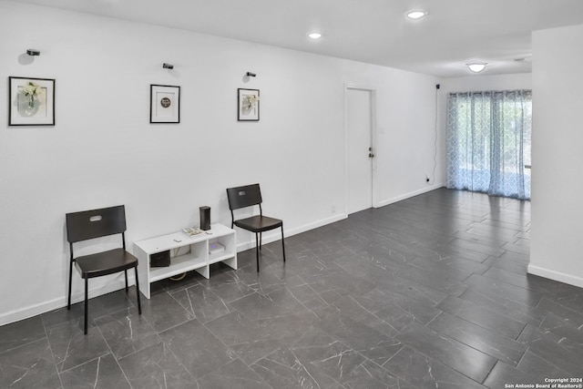 218 Rambling Dr, San Antonio, TX 78220 - living area featuring baseboards, marble finish floor, and recessed lighting