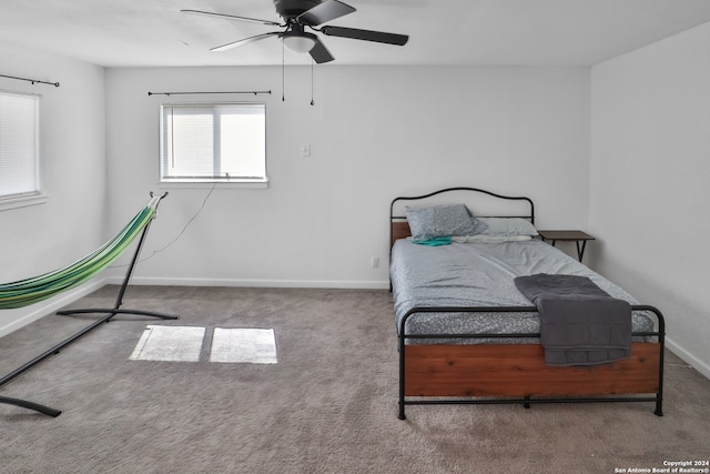 carpeted bedroom with ceiling fan