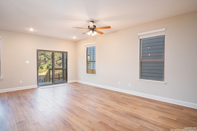 unfurnished room featuring light wood-type flooring and ceiling fan