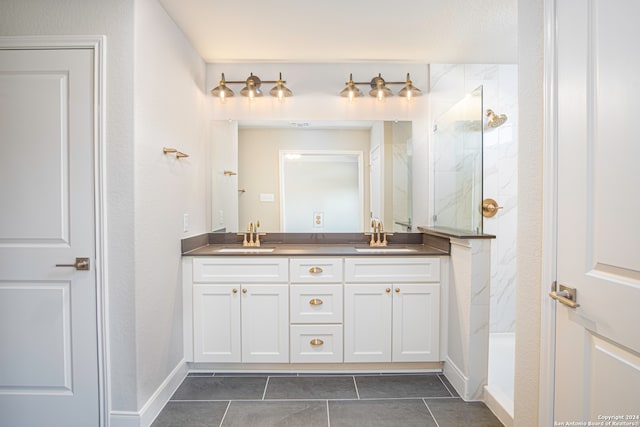 bathroom with vanity, a shower, and tile patterned flooring