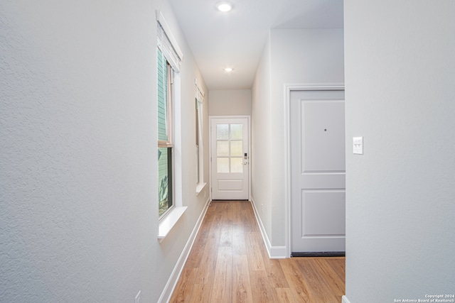 corridor featuring light hardwood / wood-style floors