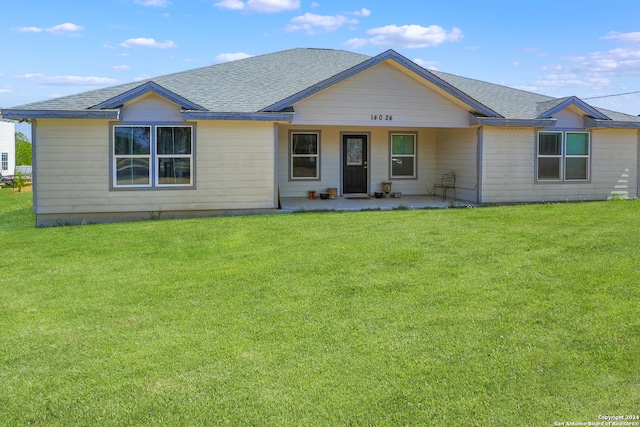 ranch-style home featuring a front yard