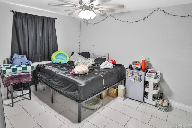 14024 Wisdom Rd, Atascosa, TX 78002 - bedroom featuring tile patterned floors, fridge, and ceiling fan