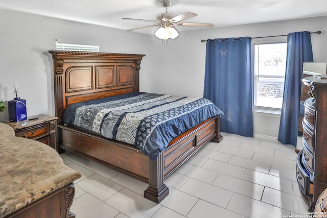 bedroom with light tile patterned floors and ceiling fan