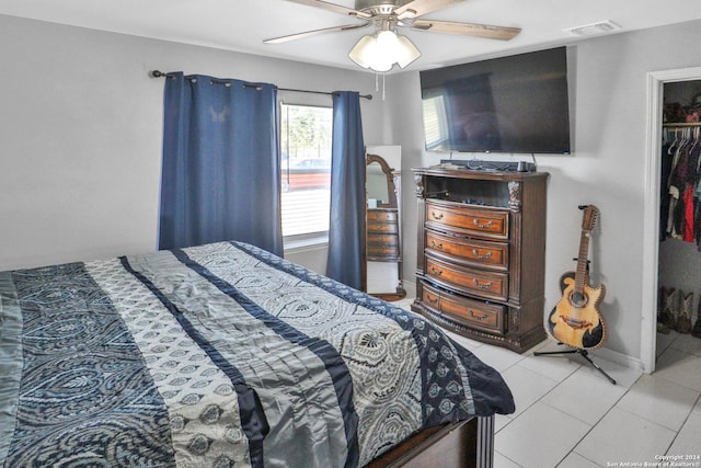 14024 Wisdom Rd, Atascosa, TX 78002 - bedroom featuring light tile patterned floors, visible vents, baseboards, a closet, and a ceiling fan