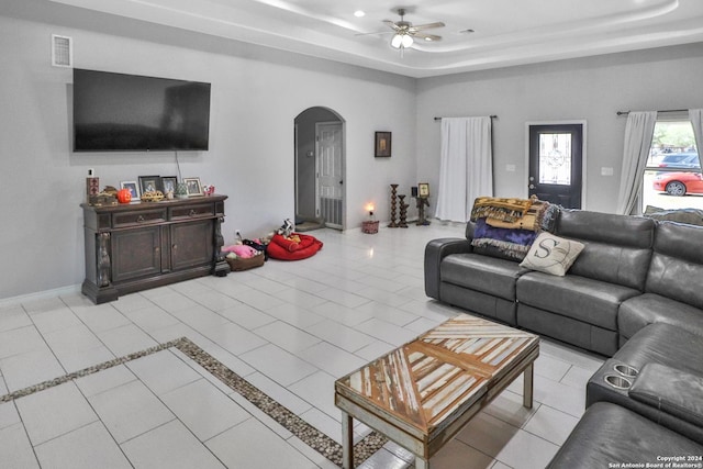 14024 Wisdom Rd, Atascosa, TX 78002 - living area featuring visible vents, arched walkways, ceiling fan, and a raised ceiling