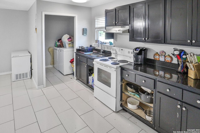 14024 Wisdom Rd, Atascosa, TX 78002 - kitchen with fridge, a sink, under cabinet range hood, white electric range, and baseboards