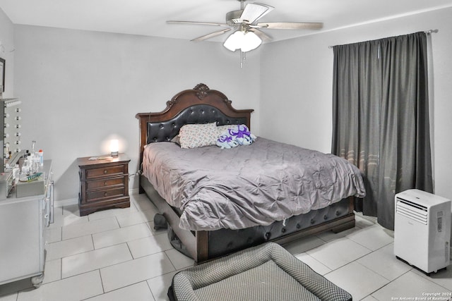 tiled bedroom with ceiling fan