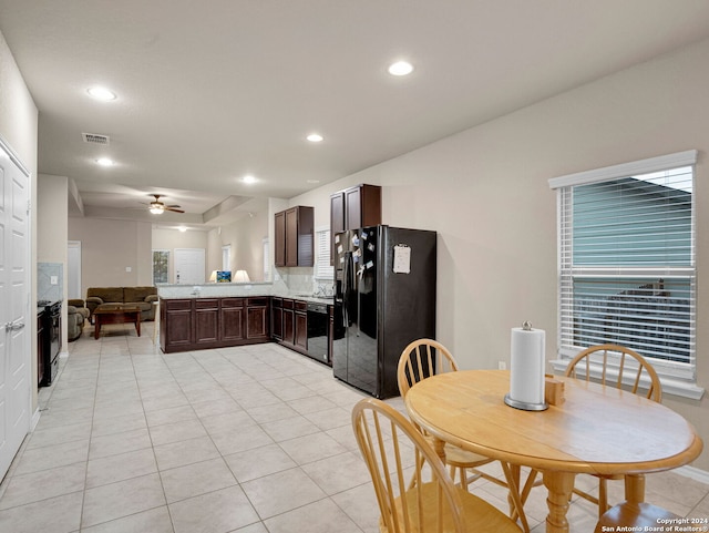 tiled dining area featuring ceiling fan