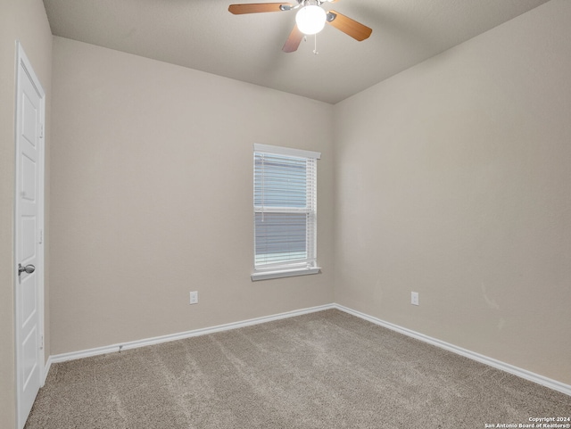 spare room with ceiling fan and carpet floors