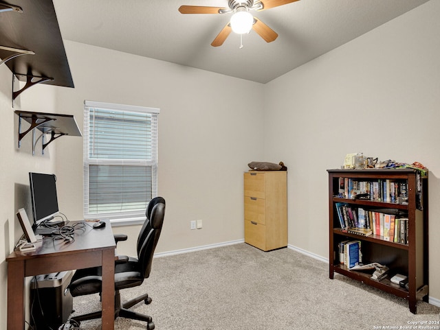 home office featuring light carpet and ceiling fan