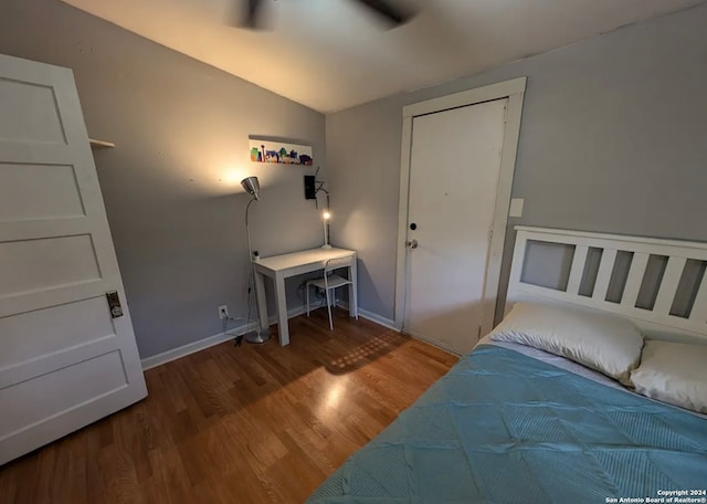 bedroom featuring a closet, ceiling fan, hardwood / wood-style flooring, and lofted ceiling