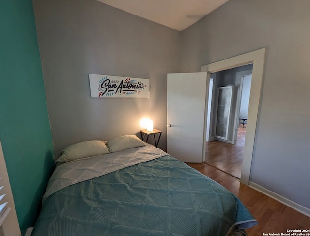 bedroom featuring hardwood / wood-style flooring