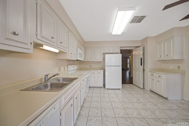 kitchen featuring sink, light tile patterned floors, white cabinets, white appliances, and ceiling fan