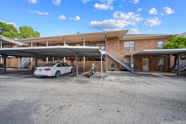 view of parking / parking lot with a carport