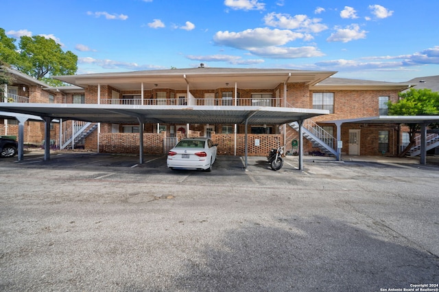 view of vehicle parking featuring a carport