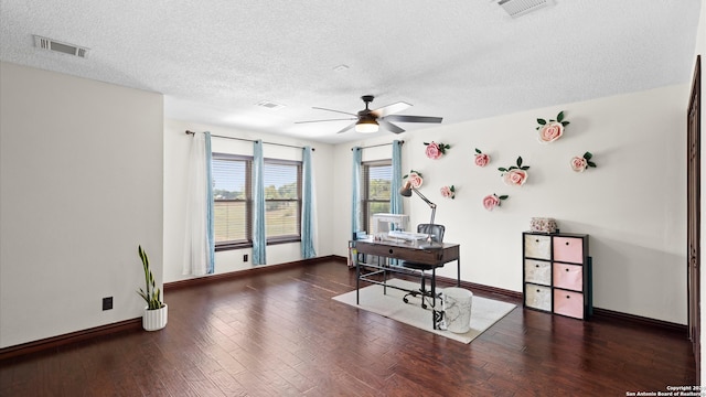 office space with dark wood-type flooring, ceiling fan, and a textured ceiling