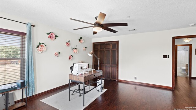 office space with ceiling fan, a textured ceiling, and dark hardwood / wood-style flooring