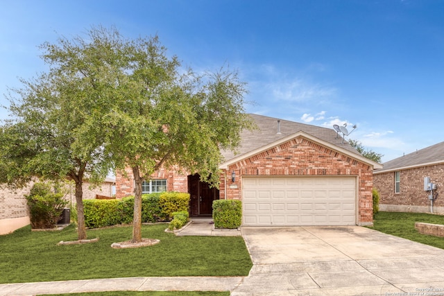 view of front of property featuring a front yard and a garage