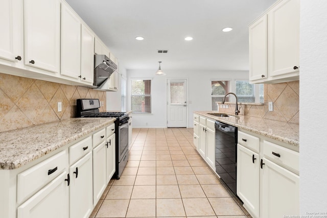 kitchen with black dishwasher, backsplash, sink, white cabinetry, and gas stove