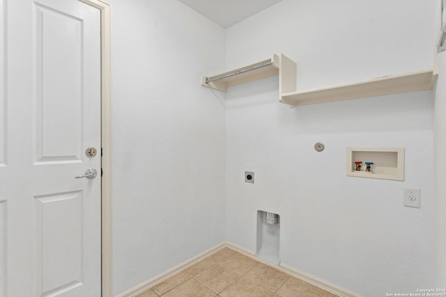 laundry room with gas dryer hookup, electric dryer hookup, washer hookup, and light tile patterned floors