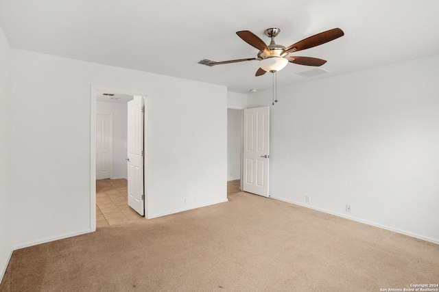 unfurnished bedroom with light carpet and ceiling fan