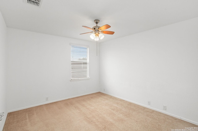 unfurnished room with light carpet and ceiling fan