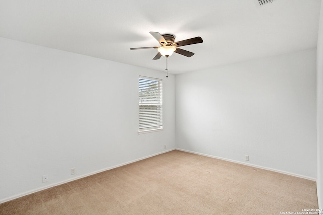 empty room featuring light carpet and ceiling fan