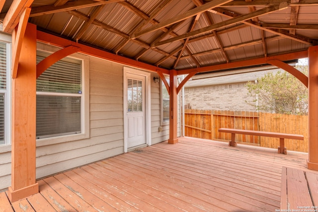 wooden terrace featuring a gazebo