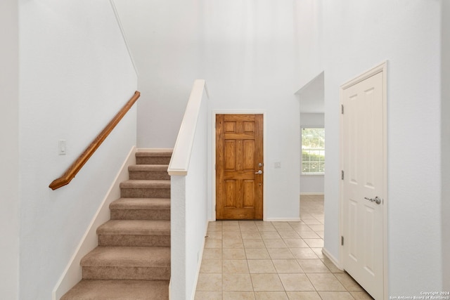 staircase with tile patterned floors