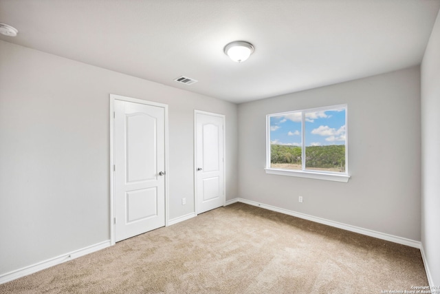 unfurnished bedroom with carpet