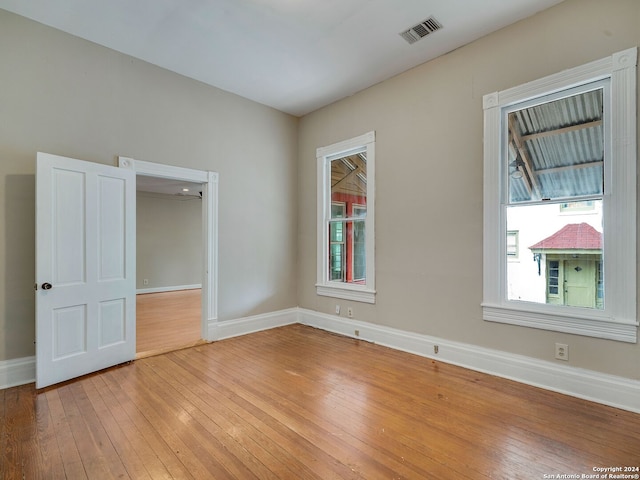 unfurnished room featuring wood-type flooring