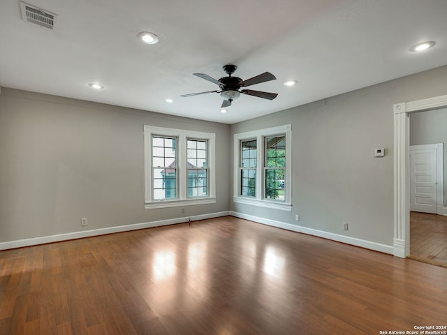 empty room featuring hardwood / wood-style flooring and ceiling fan