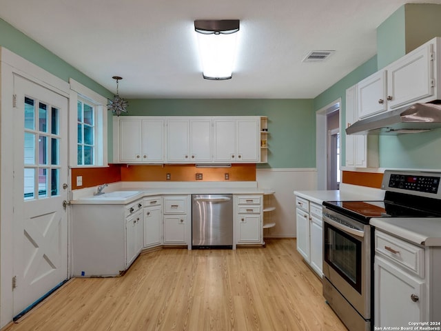 kitchen with pendant lighting, white cabinets, sink, light wood-type flooring, and appliances with stainless steel finishes