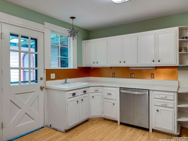 kitchen with white cabinets, pendant lighting, light hardwood / wood-style flooring, and stainless steel dishwasher