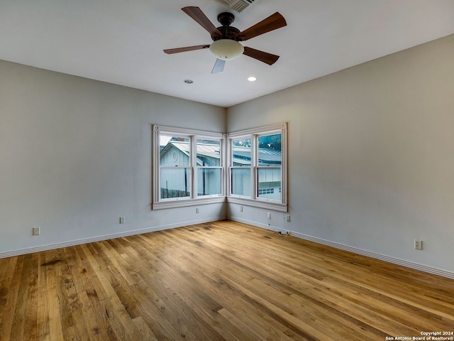 unfurnished room with light hardwood / wood-style floors and ceiling fan