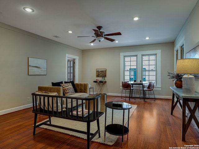 living room featuring dark hardwood / wood-style floors, ceiling fan, crown molding, and french doors