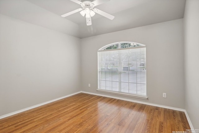 empty room featuring light hardwood / wood-style flooring and ceiling fan